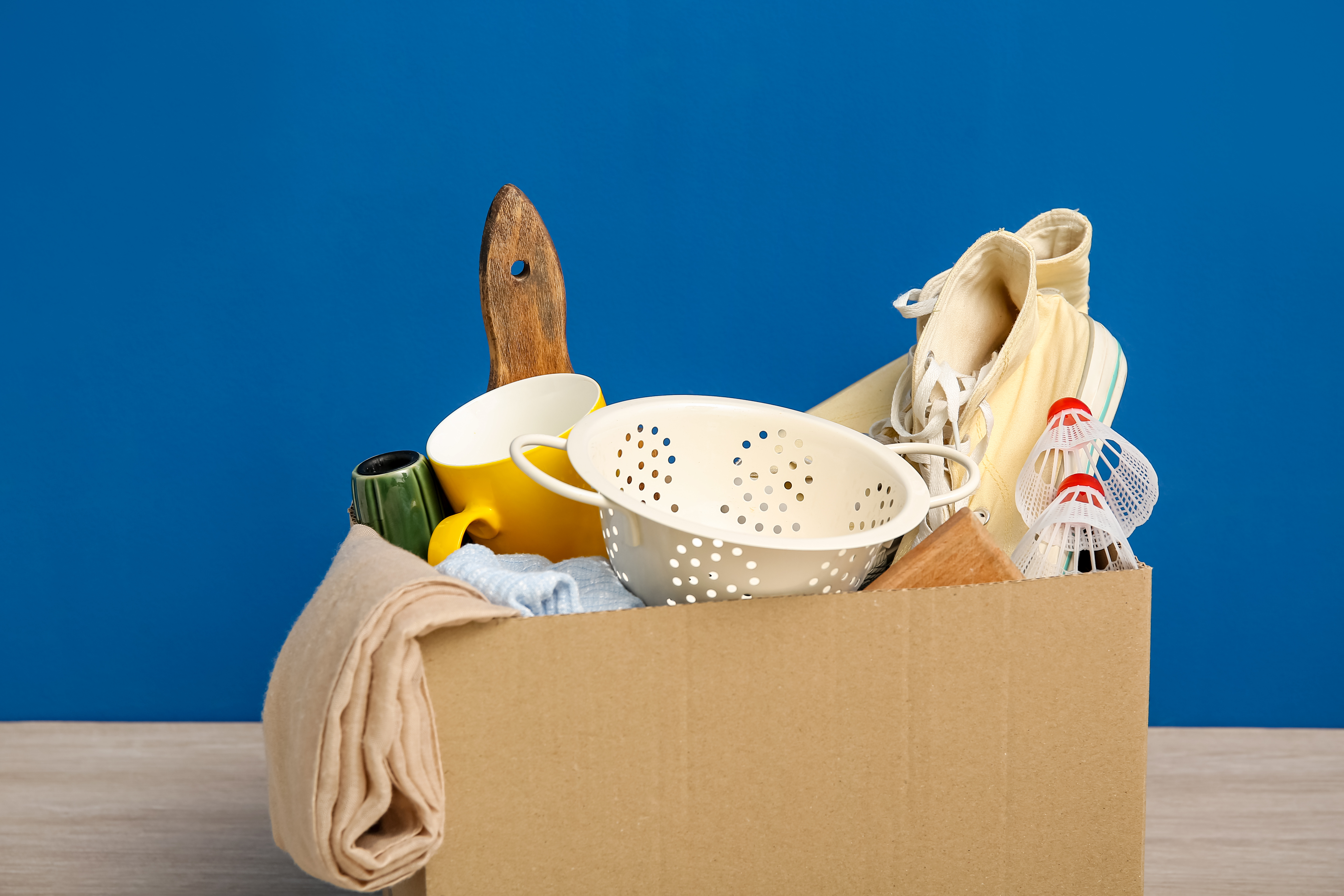 A box of unwanted possessions - Embracing Minimalism: Remove Excess Junk From Your Life with Dumpster Dudez Jacksonville 