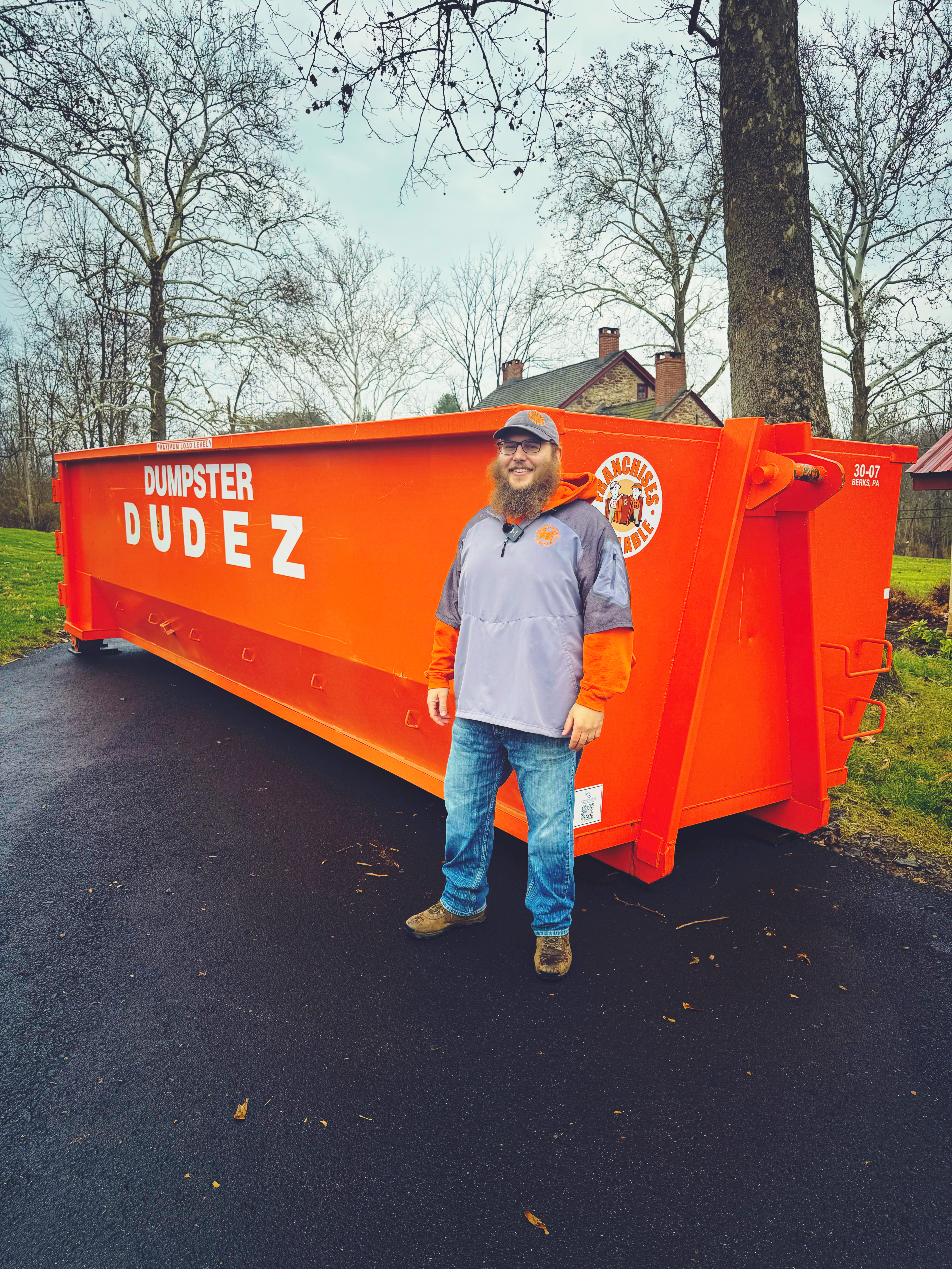 A Dumpster Dudez truck delivering a 5 yard dumpster in Berks County, PA.