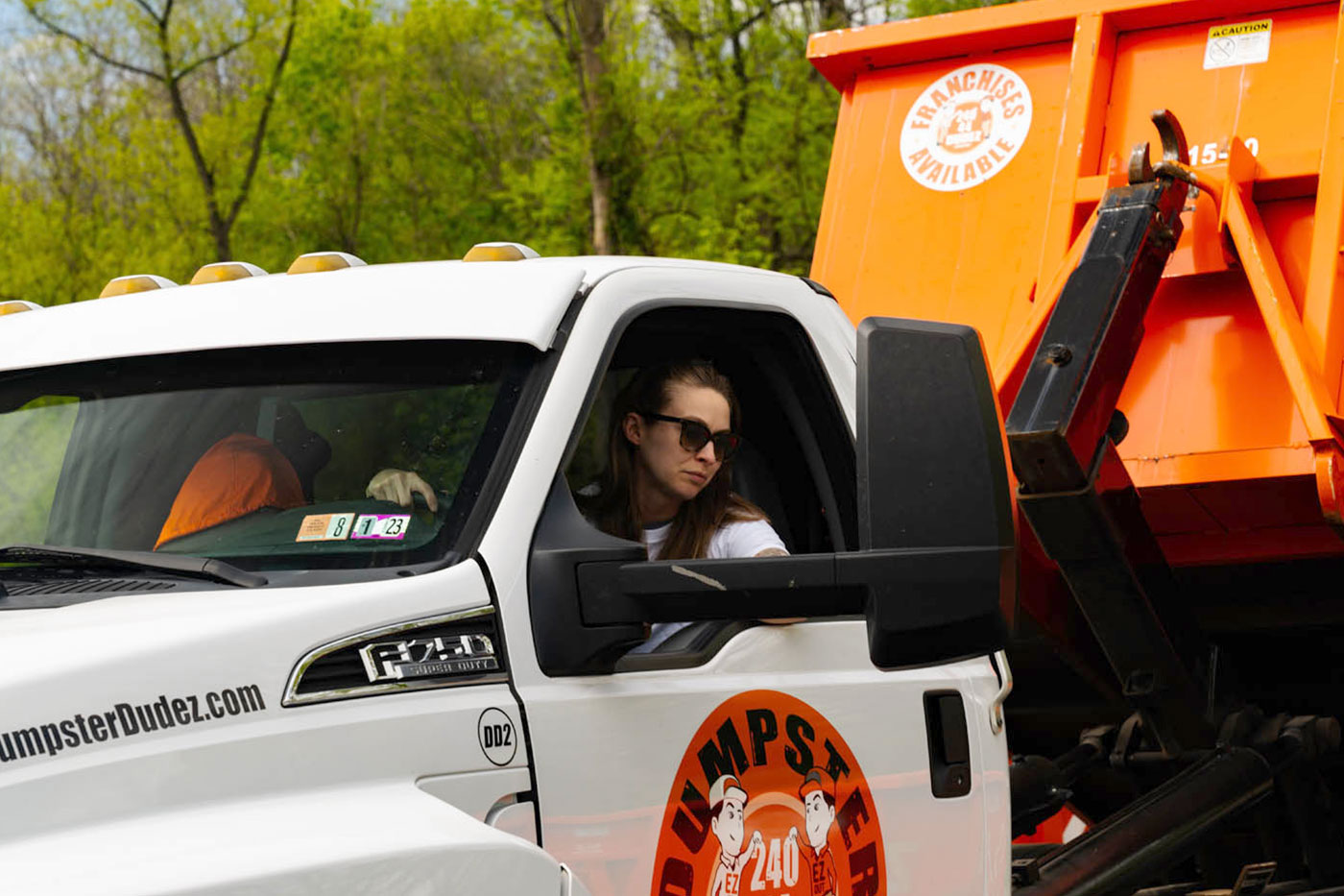 
				A roll off dumpster rental in Harrisburg / Chambersburg, {fran_state_abberv} being picked up.
			