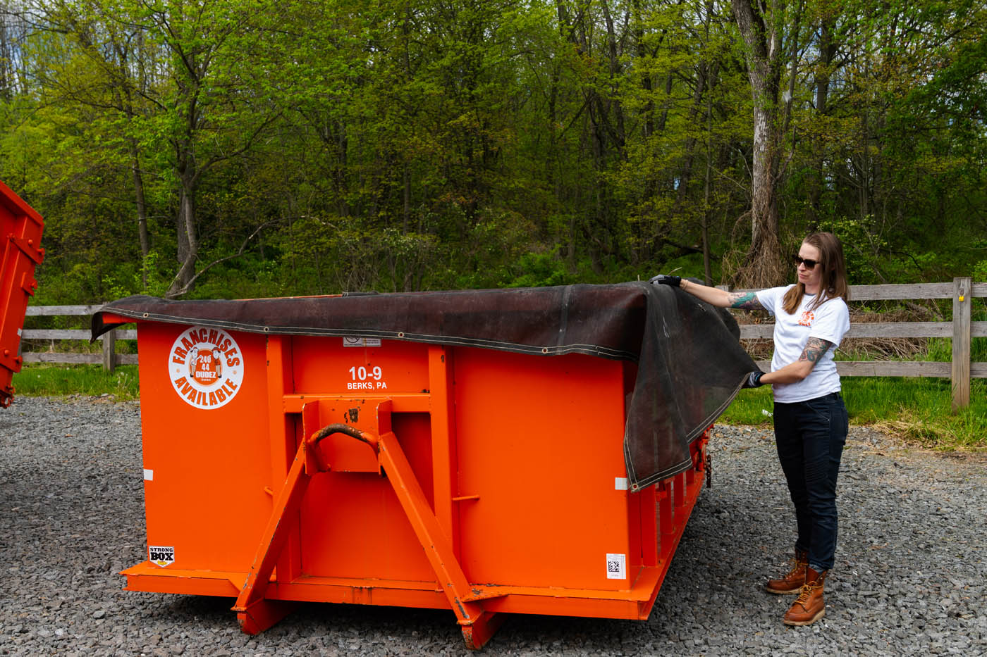 A Dumpster Dudez of Fort Worth professional presenting a small dumpster ready for rental.