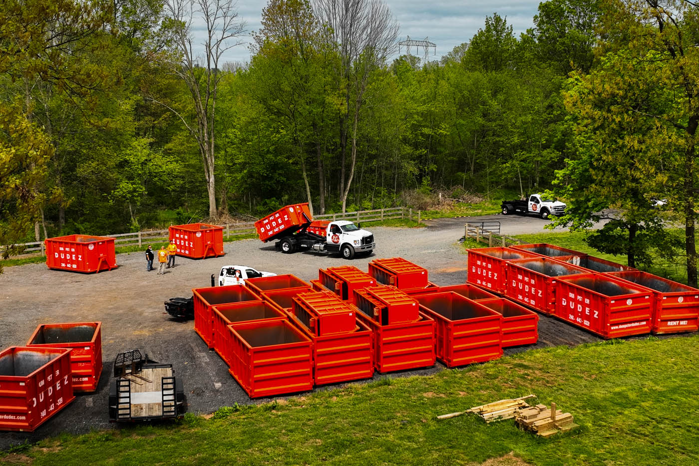 A group of Dumpster Dudez's 20 yard dumpsters in Austin, TX storage yard.