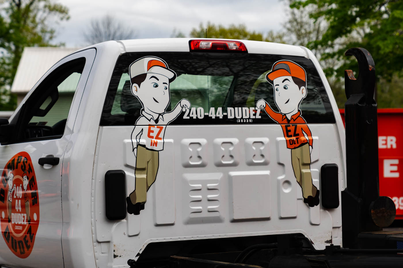 The back of a Dumpster Dudez service truck - experience how EZ waste disposal can be with our professional garbage & trash hauling services in Columbus, OH.