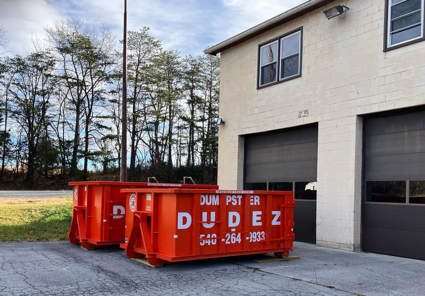A residential home with a Dumpster Dudez rental.