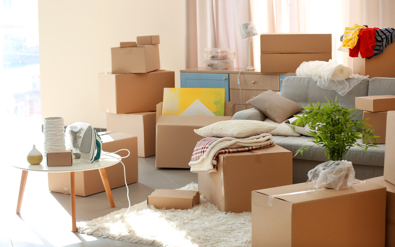 
				A cluttered home in the midst of an estate sale.
			